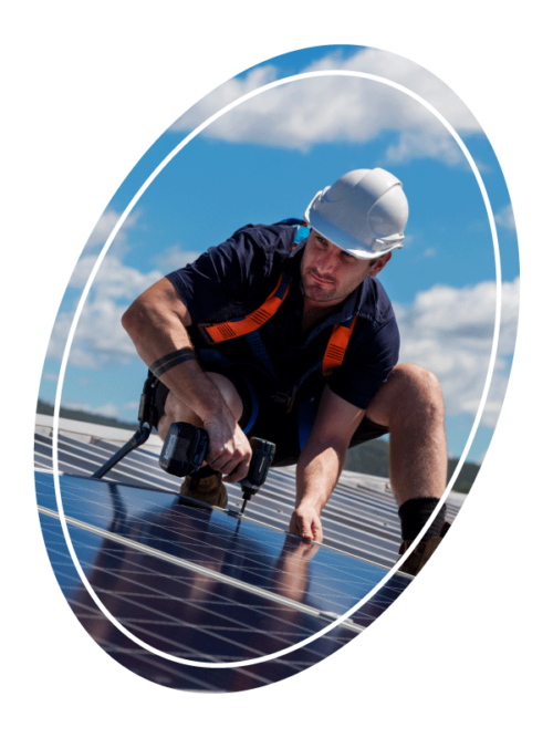 contractor with drill installing solar panels at commercial building austin tx